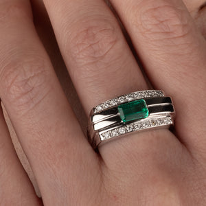 An Emerald and Diamond Ring